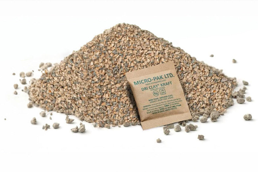 Pile of small stones with a cardboard box labeled 'Micro-Pak' on a white background